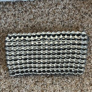 Pop tab zippered clutch